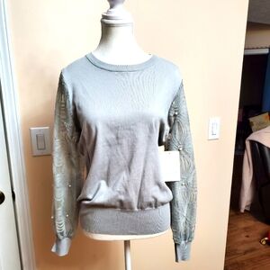 Calligraphie grey sweater dressy Size Large with banded cuffs and bottom.